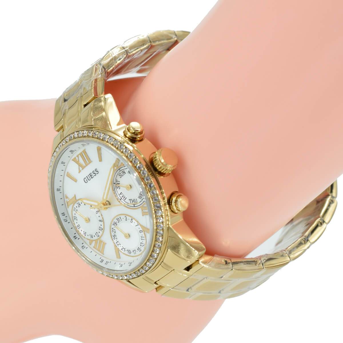 Guess Mini Sunrise diamond bezel chronograph on wrist in gold tone