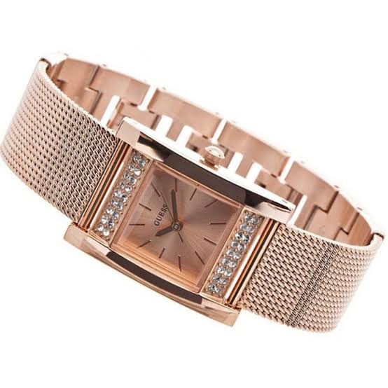 Guess Nouveau rose gold square watch with diamond bezel and mesh strap, angled view