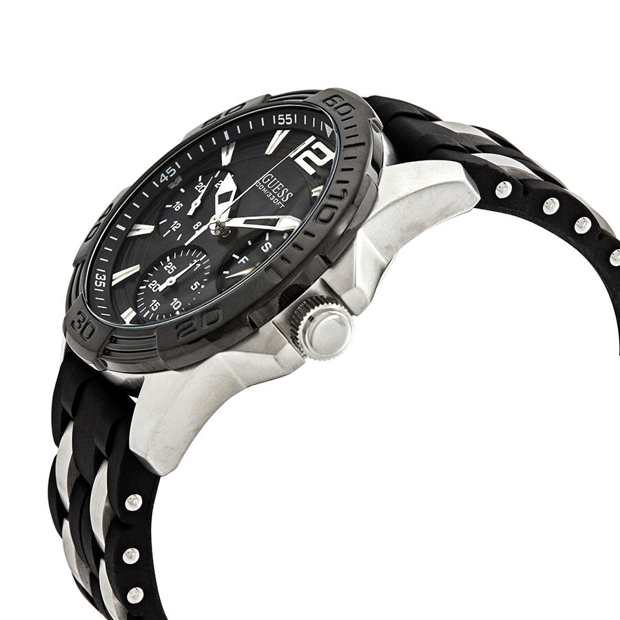 Guess Oasis men's watch displayed on wrist with silver case and black rubber strap