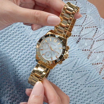 Guess Phoebe GW0696L2 gold watch worn on wrist