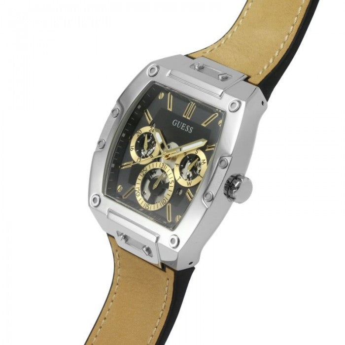 Guess Phoenix watch on wrist angle view showing beige leather strap and steel case with gold accents