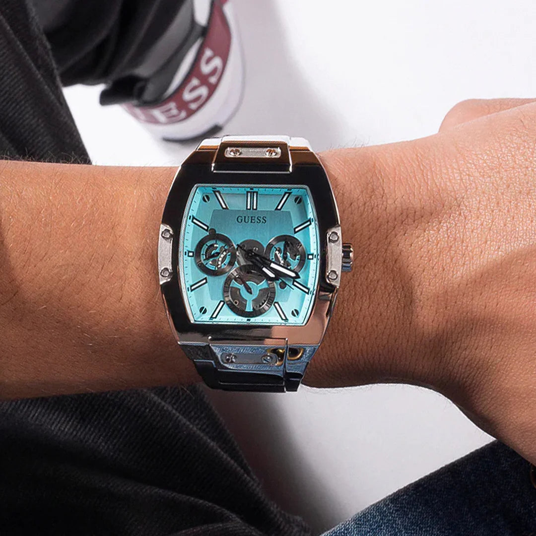 Guess Phoenix watch on wrist showing turquoise blue dial and white index markers