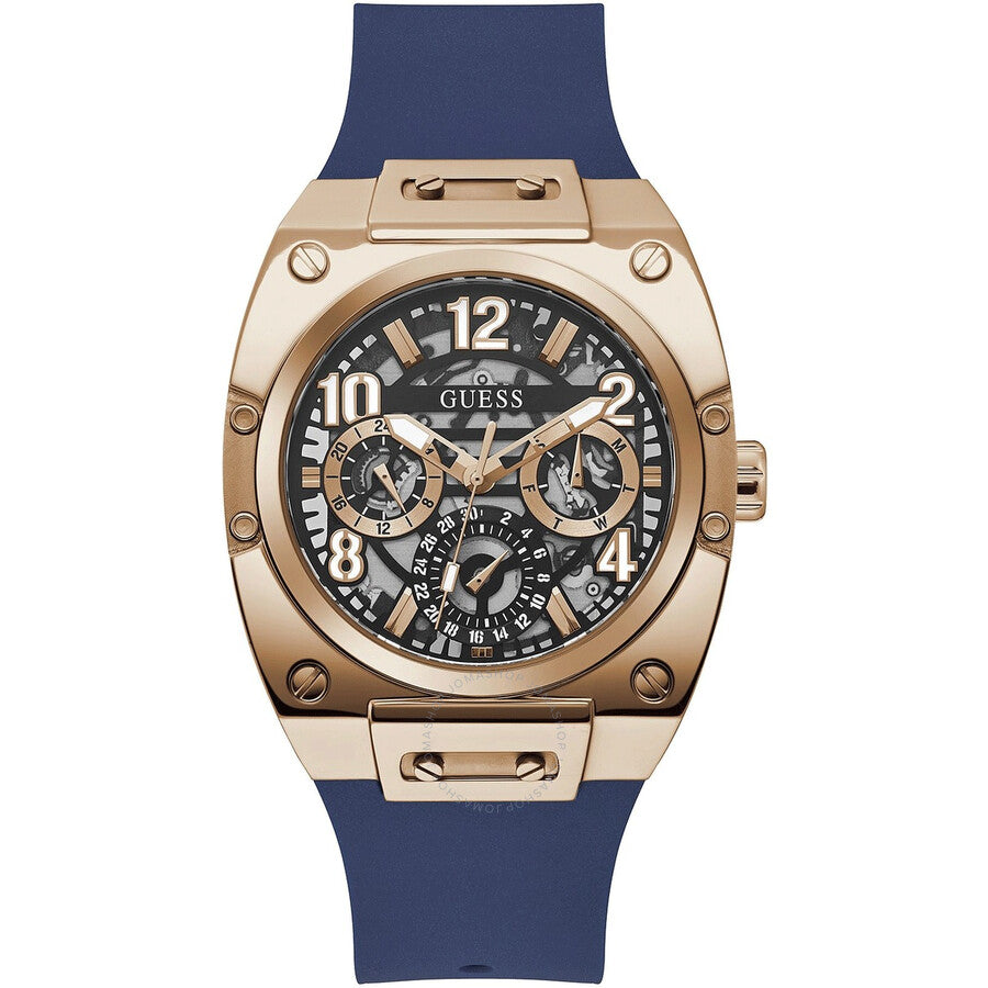 Guess Prodigy men's watch with rose gold case, blue skeleton dial, and navy blue silicone strap