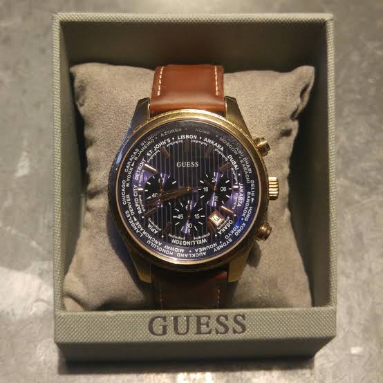 Guess Pursuit watch with brown leather strap displayed in white Guess branded box