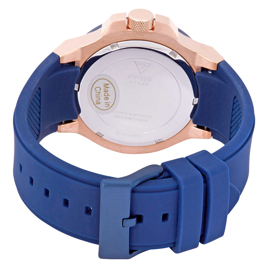Case back view of Guess Rigor watch showing blue silicone strap and rose gold case
