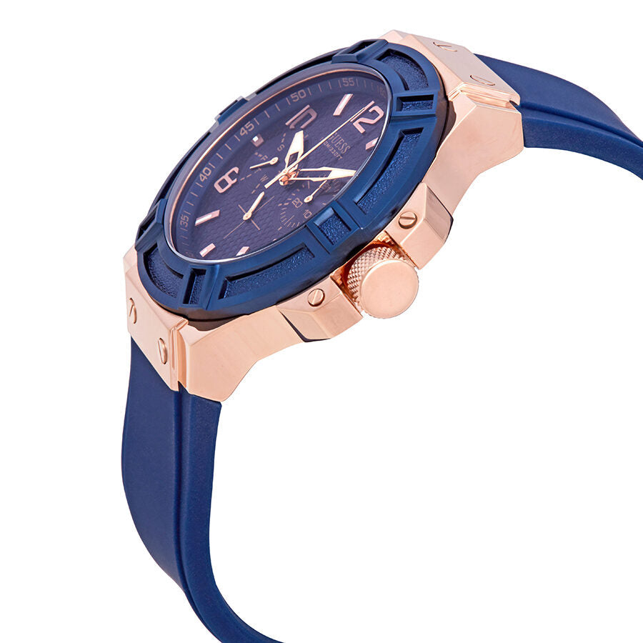 Side angle view of Guess Rigor watch showing blue dial, rose gold case, and blue strap