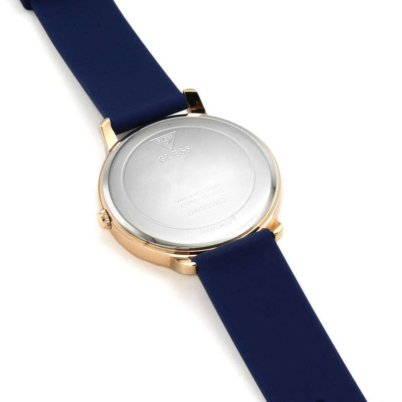Side profile of Guess Sunrise watch with blue rubber strap and gold-tone case