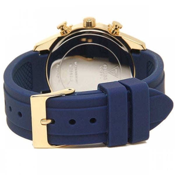 Back view of Guess Sunrise watch showing silver caseback with blue rubber strap and gold buckle