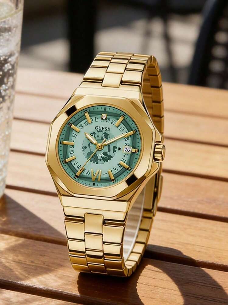 Guess Super Nova watch with turquoise dial worn on wrist
