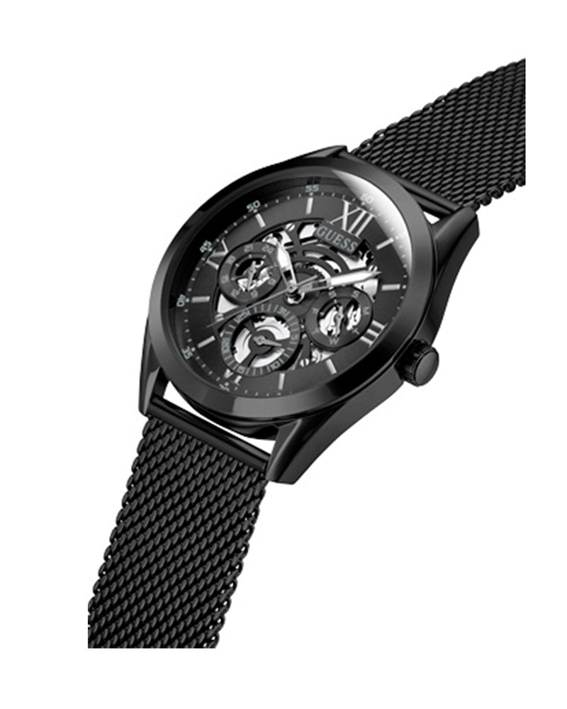 Guess Tailor men's watch at angle showing skeleton dial and mesh strap