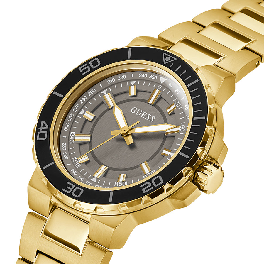 Guess Track watch at angle showing gold bracelet and black bezel detail