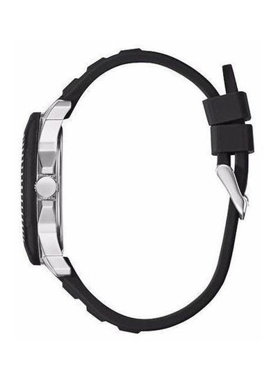 Guess Tread watch with black silicon strap shown on wrist