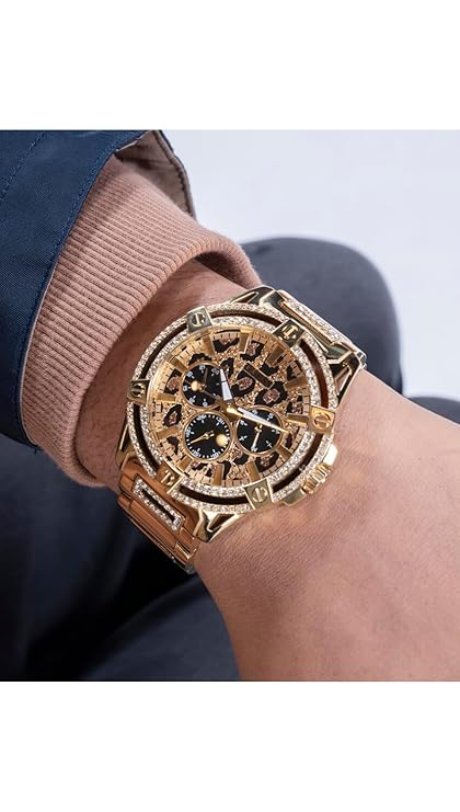 Guess Trend chronograph watch on-wrist showing gold case, crystal bezel, and animal print dial