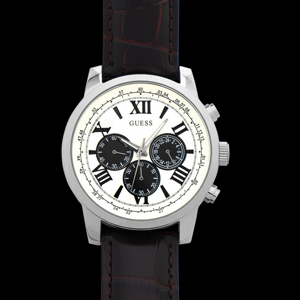 Guess men's chronograph watch on wrist showing white face with Roman numerals and black subdials