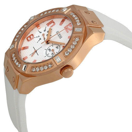 Guess rose gold women's watch angled view showing case profile and white silicon strap
