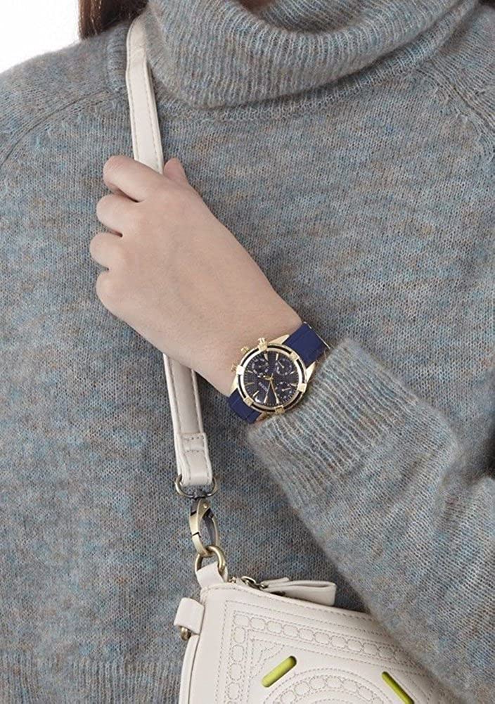 Guess W0562L2 chronograph watch on wrist styled with casual accessories