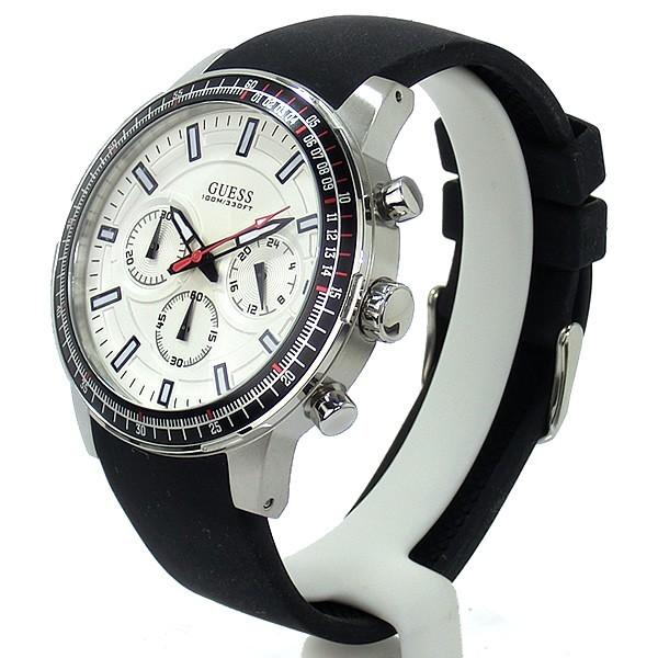 Guess men's chronograph watch side view with silver case and black silicon strap