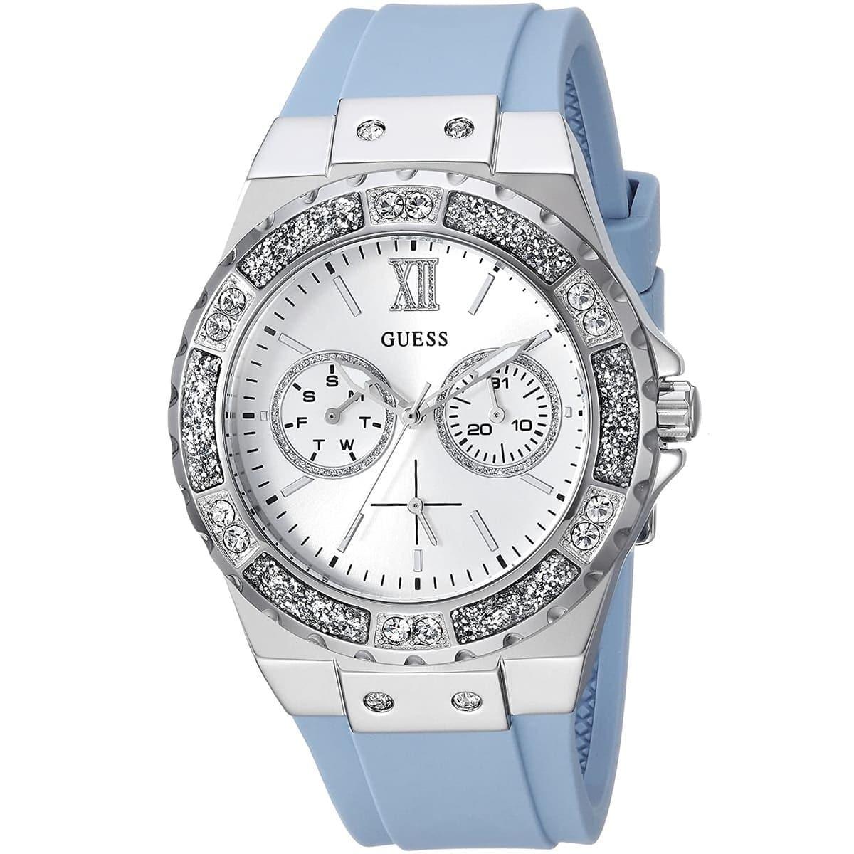 Guess ladies watch with silver dial, crystal bezel, blue rubber strap, and dual chronograph subdials