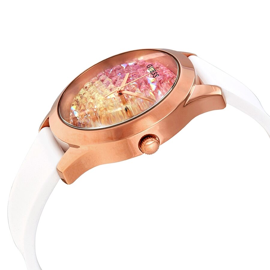 Guess W1223L3 watch angled view showing gold-tone case profile with white strap and sparkle dial