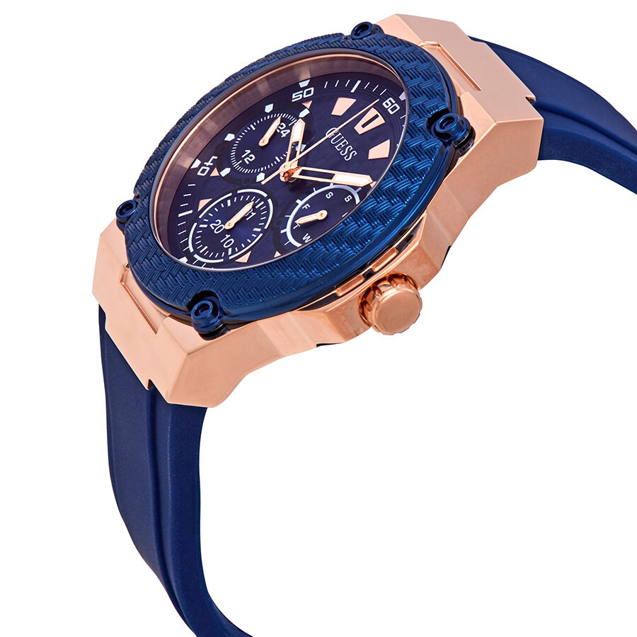 Guess Zena watch angled side view showing rose gold case, blue dial, and navy rubber strap