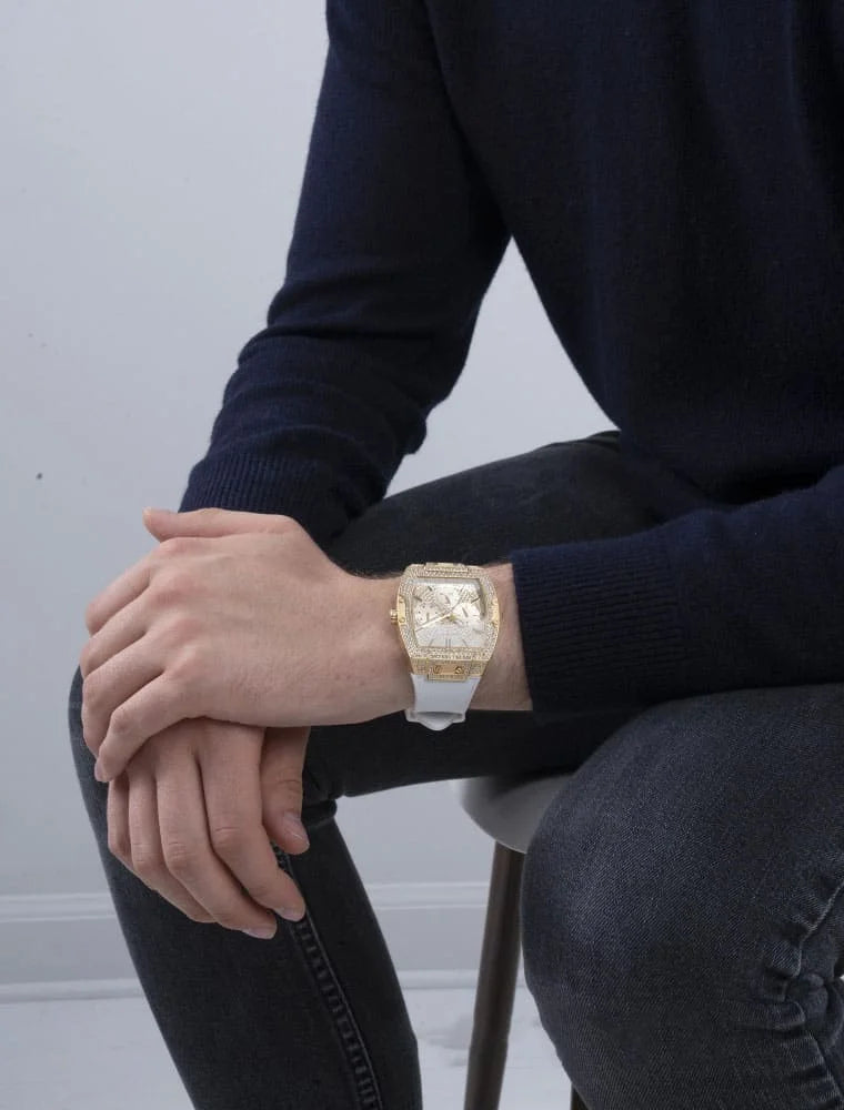 Guess Phoenix watch on wrist showing gold case with white silicone strap