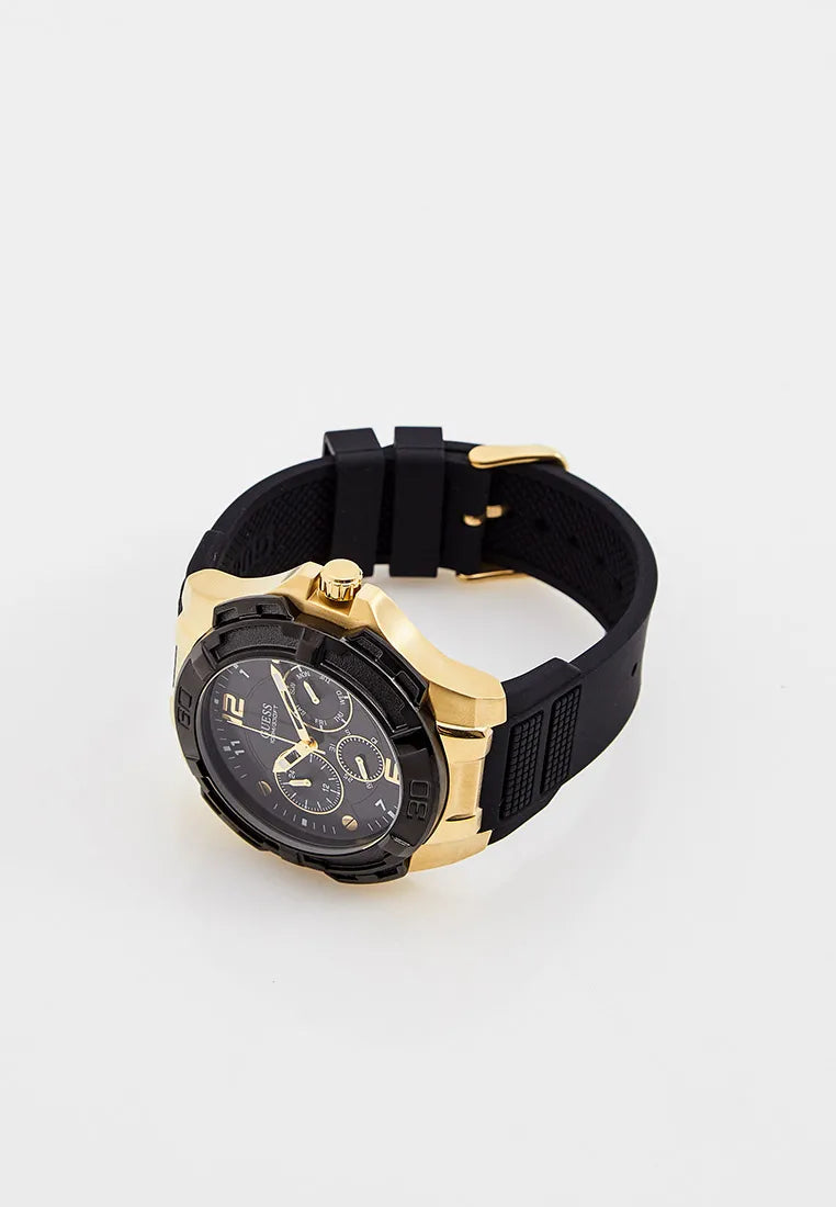Guess Genesis chronograph watch worn on wrist showing black dial and gold case