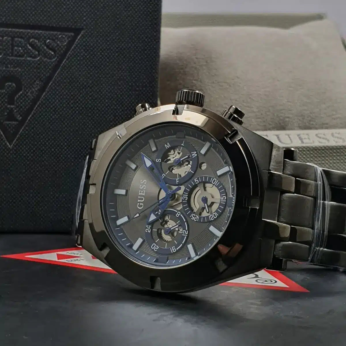 GUESS GW0260G3 watch displayed with product packaging and box