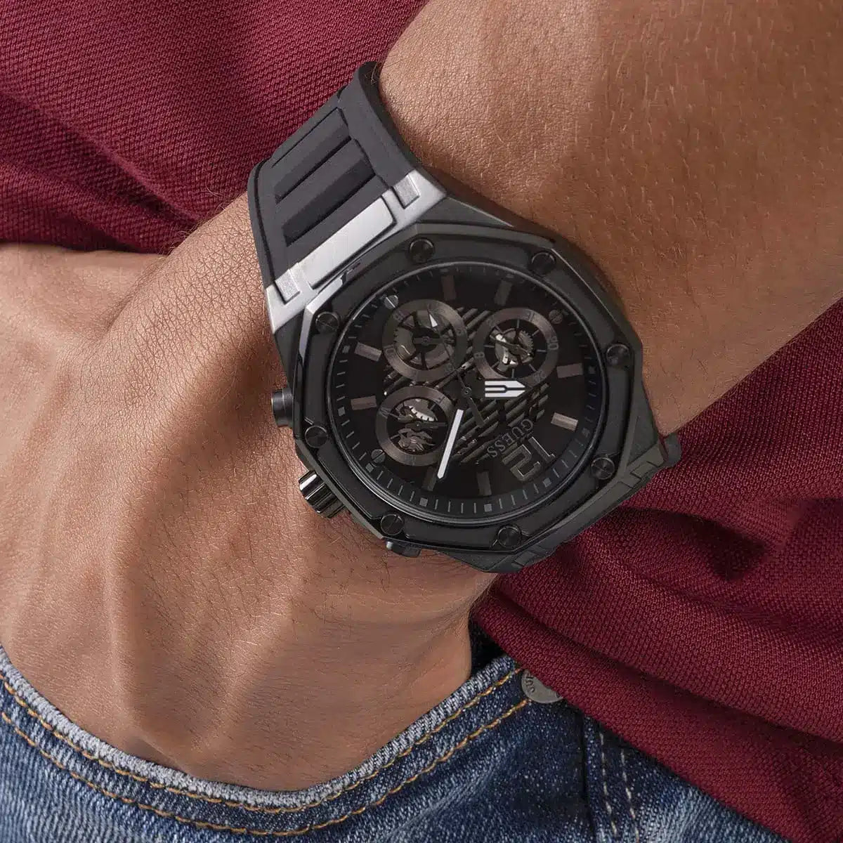 Guess GW0263G4 black watch worn on wrist with skeleton dial visible