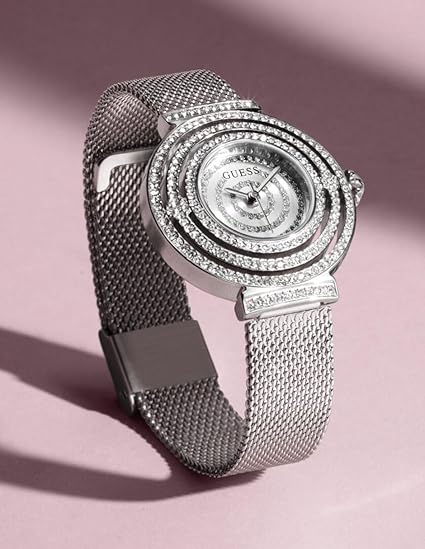 GUESS Dream women's watch worn on wrist, showcasing crystal-adorned case and dial