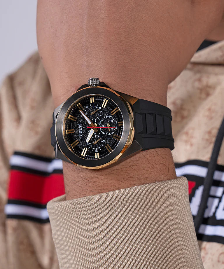 GUESS GW0799G1 black chronograph watch on wrist with black strap and dial detail