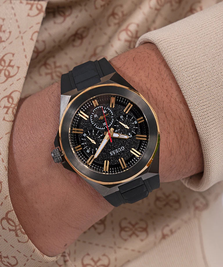 GUESS GW0799G1 multi-function chronograph watch worn on wrist in lifestyle setting