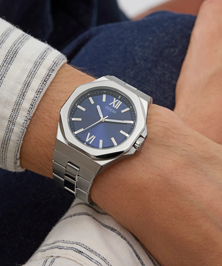 GUESS GW0849G1 watch worn on wrist with blue dial and silver bracelet