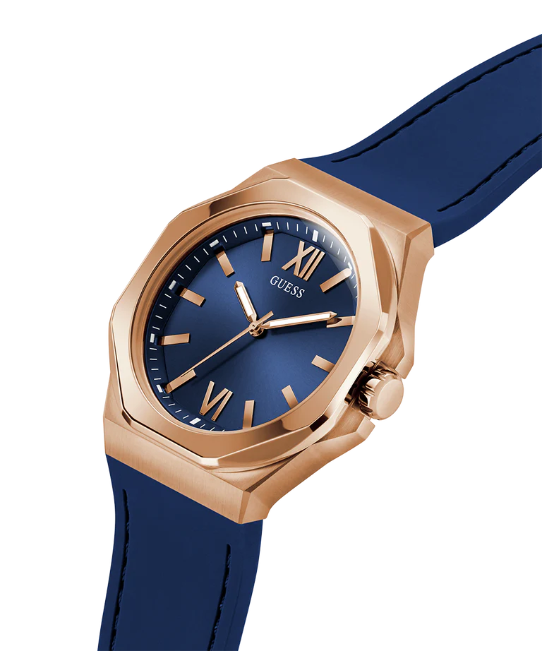 GUESS rose gold watch worn on blue silicone strap angled view