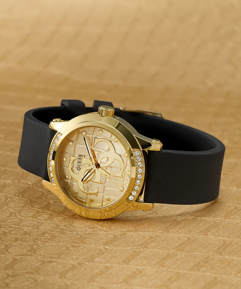 GUESS gold watch on neutral background showing dial and strap detail