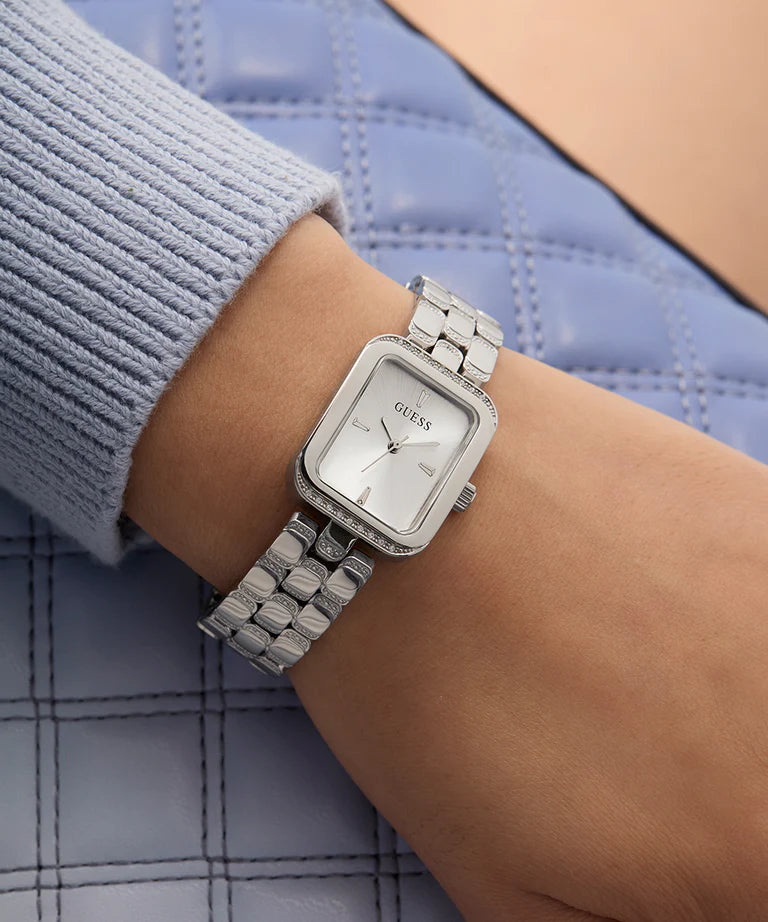GUESS GW0865L1 watch worn on wrist with silver stainless steel bracelet