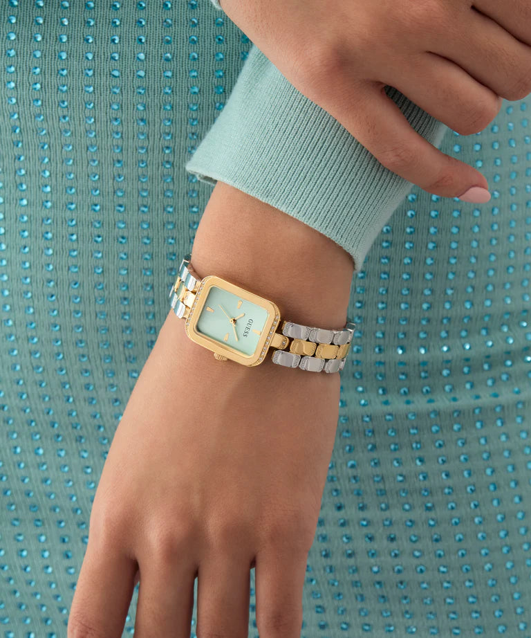 GUESS GW0865L4 watch on wrist showing 2-tone bracelet and gold case