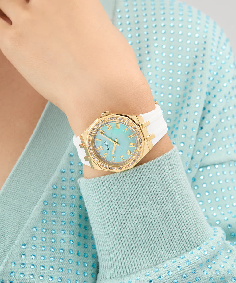GUESS GW0872L1 watch worn on wrist showing light blue dial and gold tone case