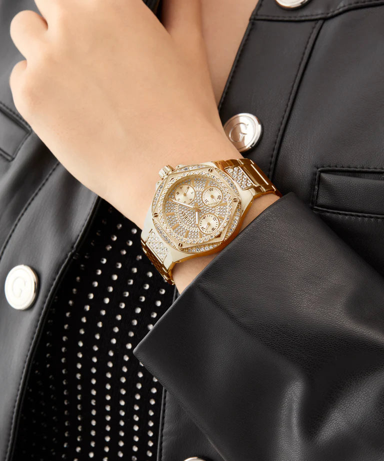 GUESS gold-tone chronograph watch on wrist styled with black jacket
