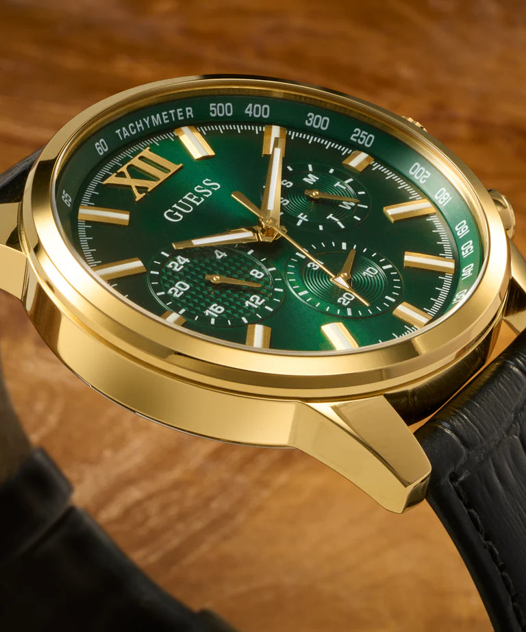 Close-up of GUESS GW0901G4 dial showing chronograph subdials, tachymeter scale, and Roman numerals