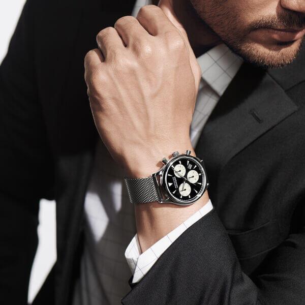Heritage Calendoplan chronograph watch worn on wrist with black dial and mesh strap