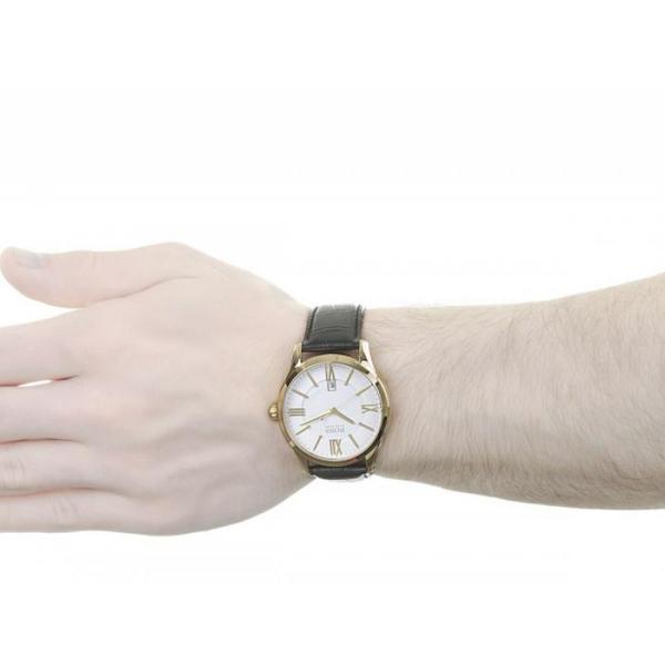 Hugo Boss watch worn on wrist displaying white dial with Roman numerals and gold-tone case