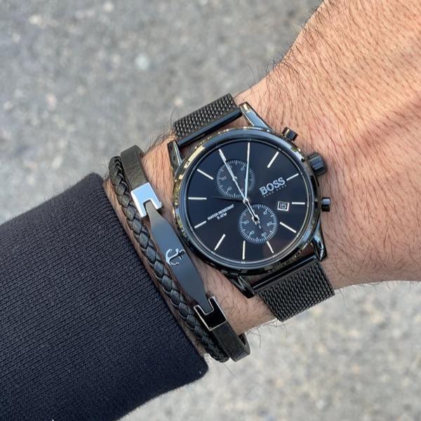 Hugo Boss 1513769 black chronograph watch worn on wrist with black metal mesh bracelet