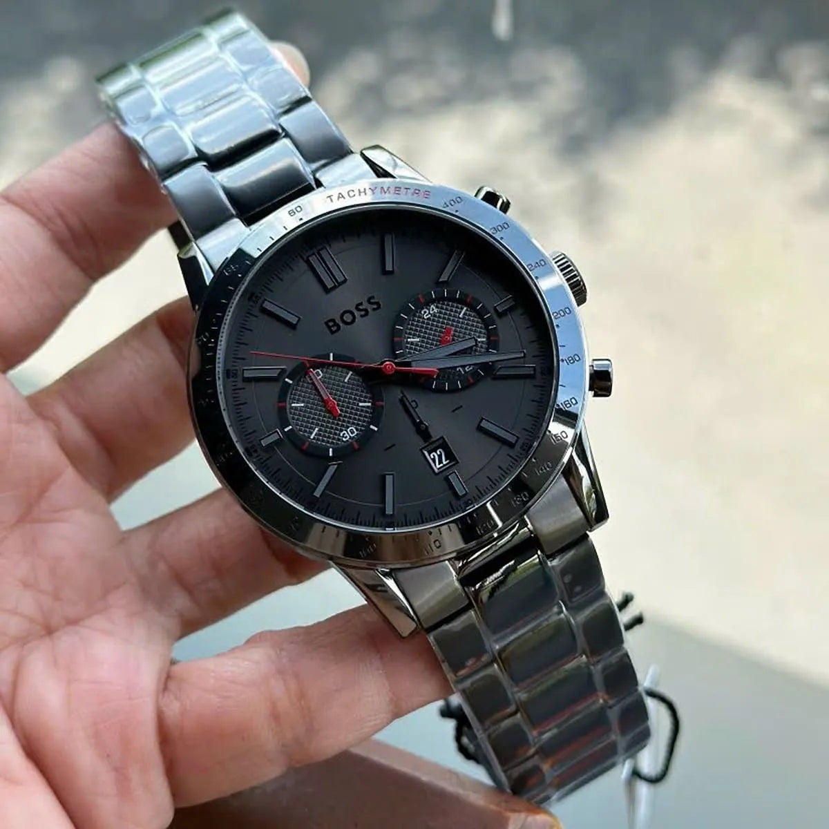 Hugo Boss Allure chronograph watch worn on wrist showing grey dial and steel bracelet