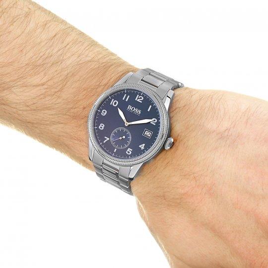 Hugo Boss blue dial silver watch worn on wrist showing dial, subdial and date window