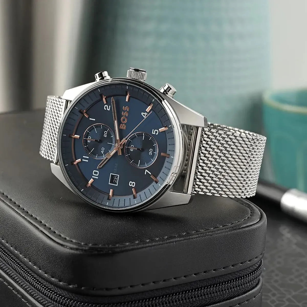 Hugo Boss Strike men's watch on wrist showing blue dial and chronograph complications