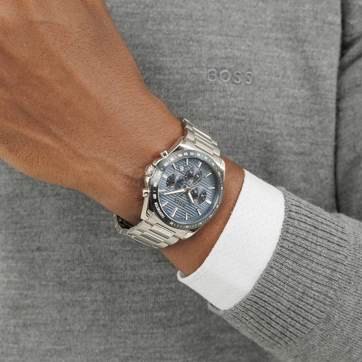 Hugo Boss Strike chronograph watch worn on wrist with blue dial and metal bracelet