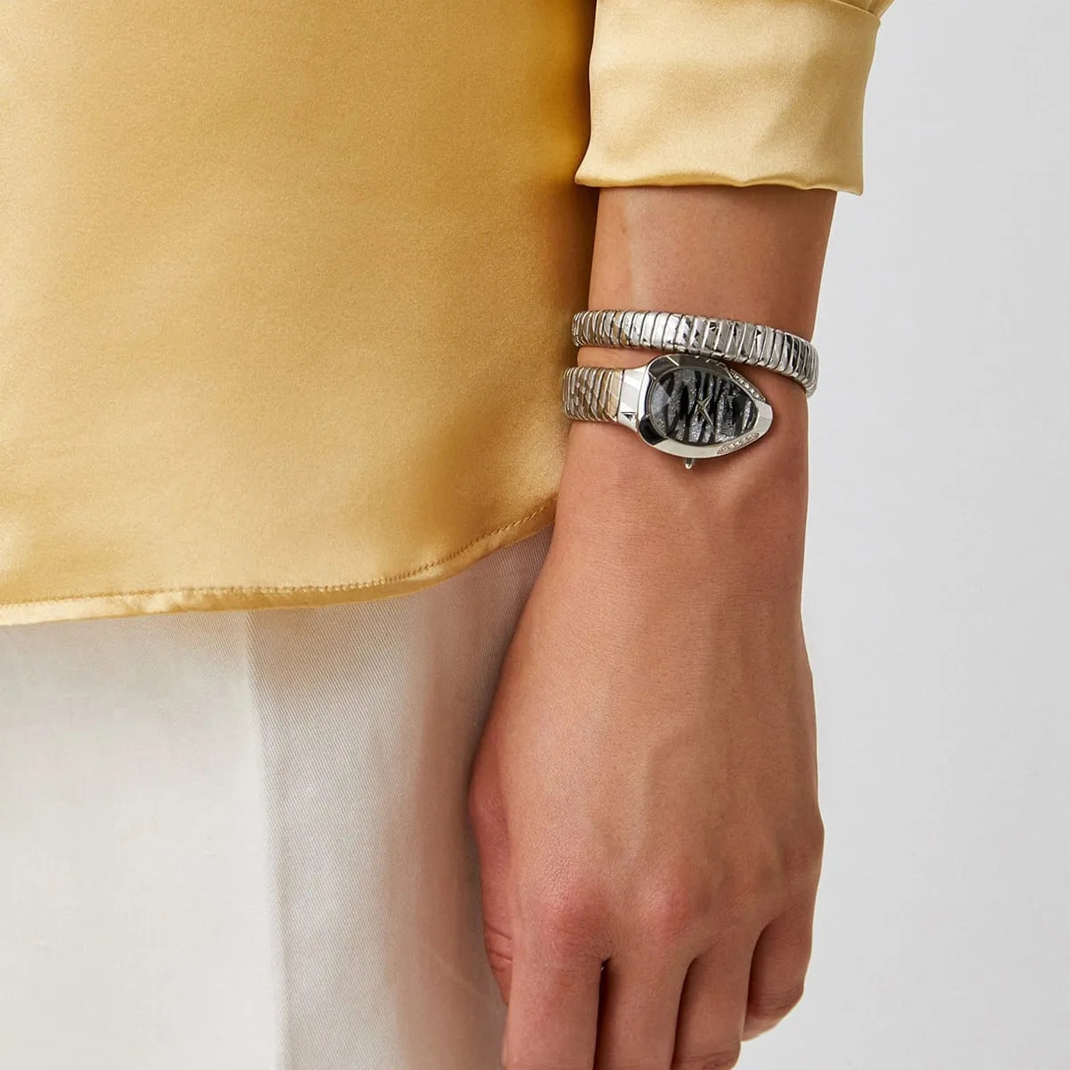 Just Cavalli Signature Snake watch on wrist showing snake-pattern dial and double-wrap design from side