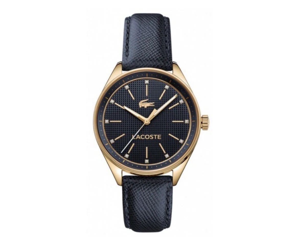 Lacoste women's quartz watch with gold case, black dial, and navy leather strap