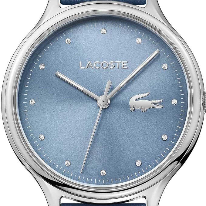 Close-up of blue dial with crystal hour markers and Lacoste branding