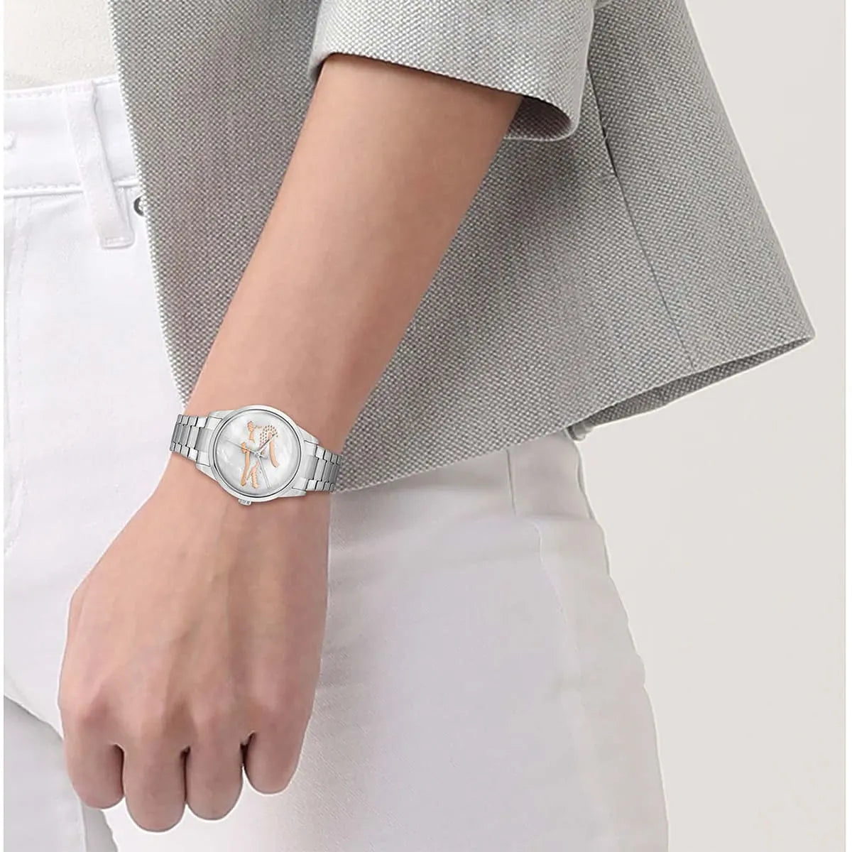 Lacoste stainless steel women's watch with mother of pearl dial worn on wrist